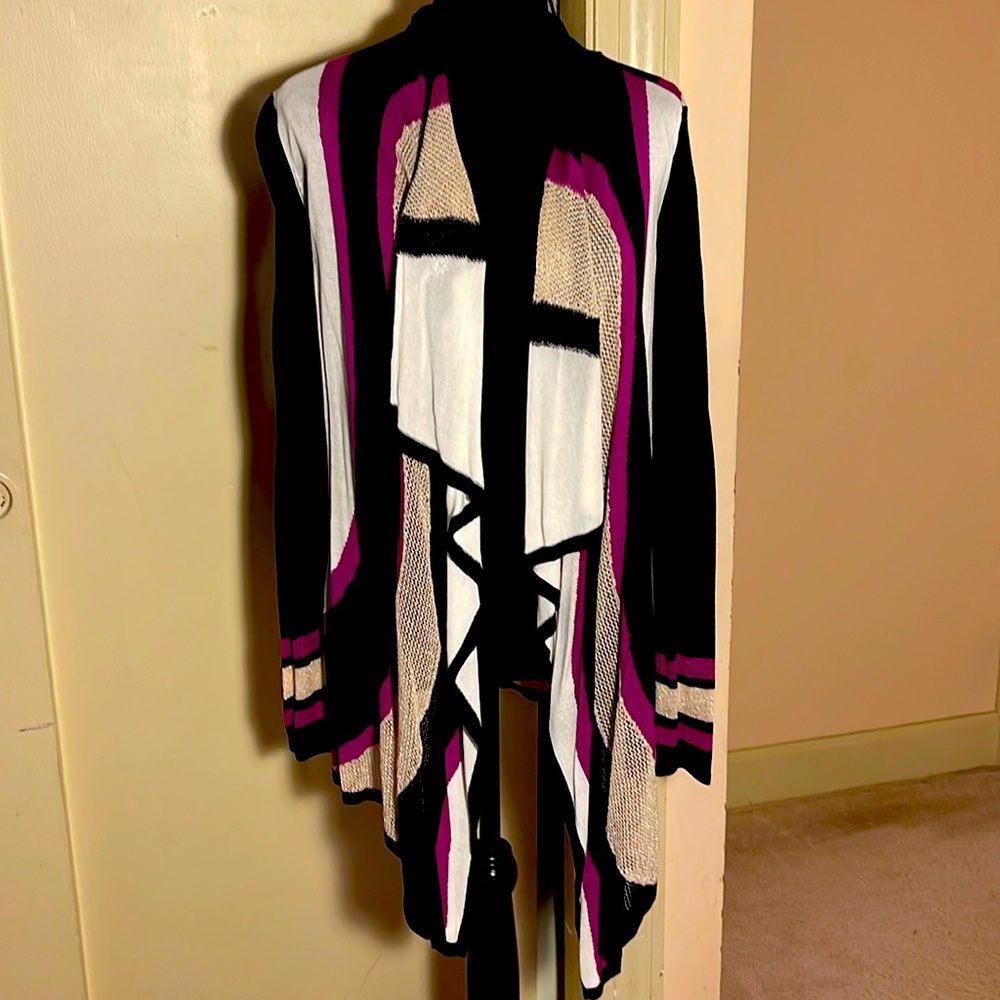 Bright, open cardigan with fun abstract design in black, white, fuchsia & gold.